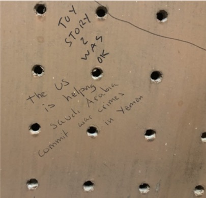 A pegboard with two different handwritings